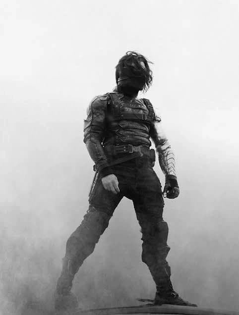 (Winter Soldier looks up, his eyes cold) I don't know you, but you seem to know me. (He tightens the grip on his metal arm, ready to strike at any moment) thumbnail