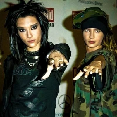Tom Kaulitz the one with the cap and Bill the one with the smoky eyes thumbnail