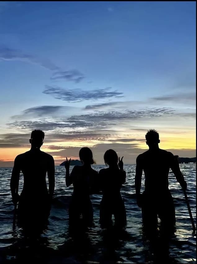 Two women and two men thumbnail