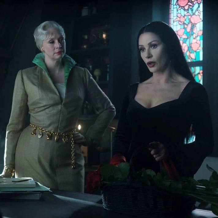 Larissa Weems and Morticia Addams thumbnail