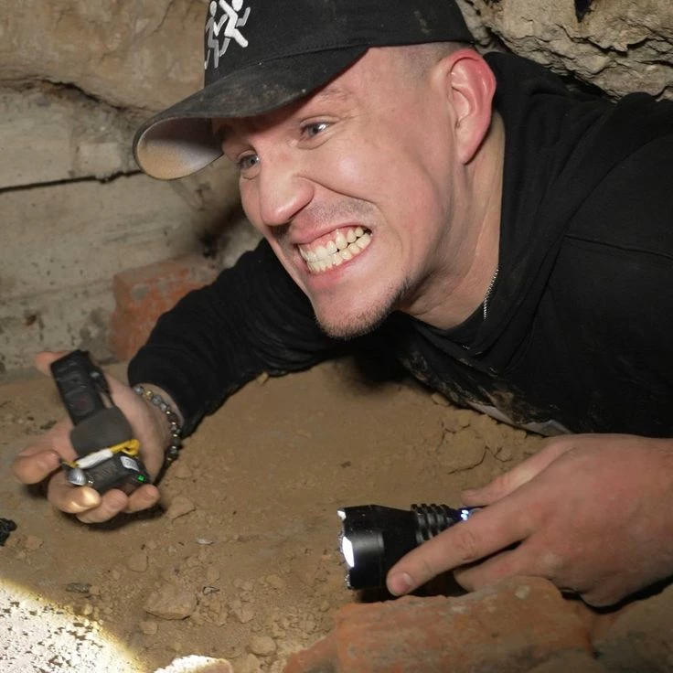 Dima Maslennikov in the cave with the team thumbnail