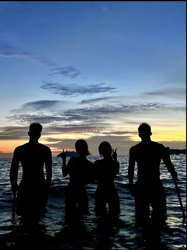 Two women and two men thumbnail
